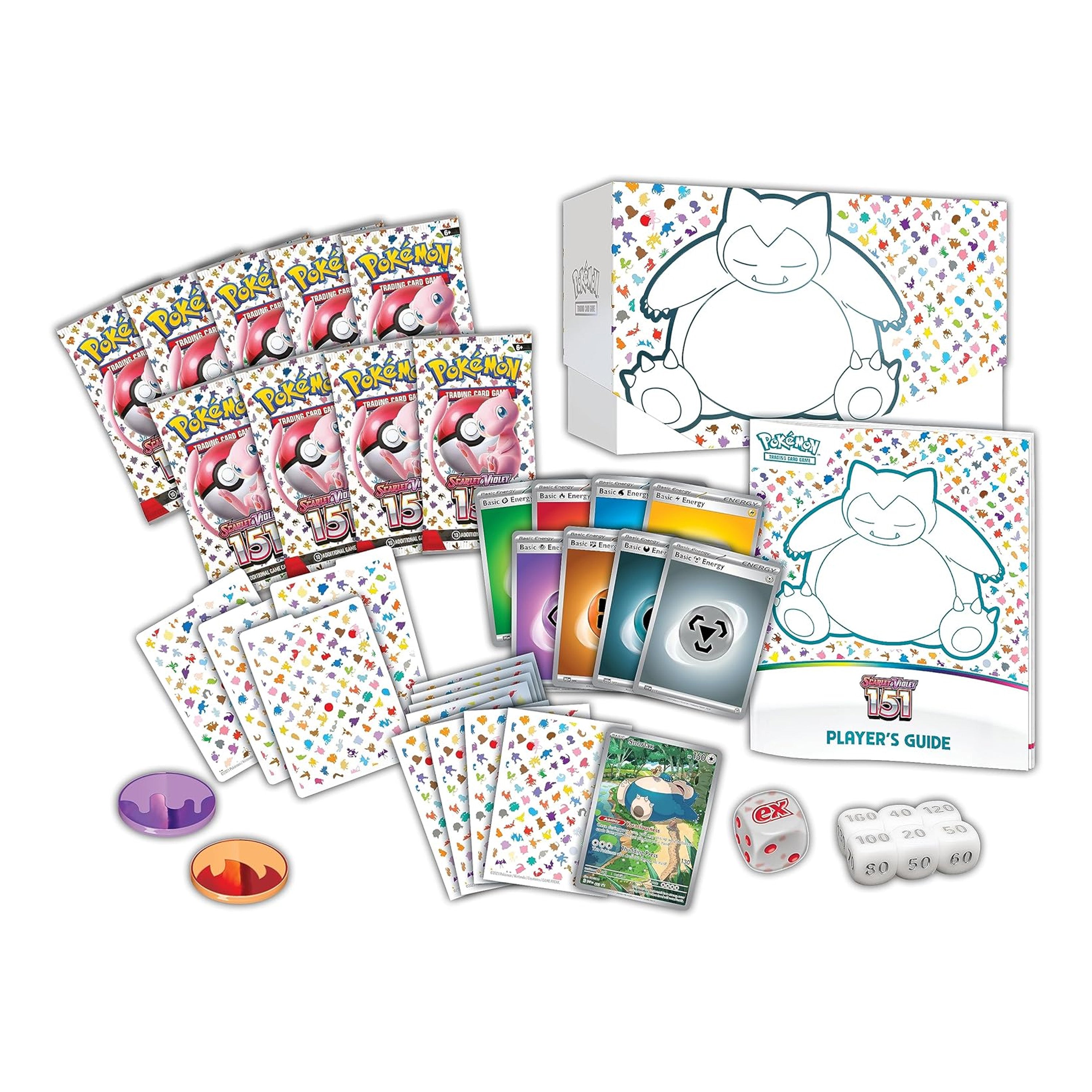 Pokémon trading card game set with cards, a player's guide, and dice on a white background